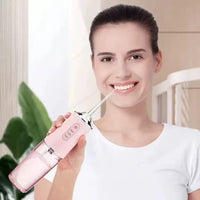 IRRIGADOR DENTAL PORTATIL